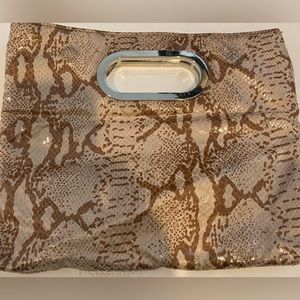 Beige clutch. Closes with magnet. Nice dinner or lunch bag